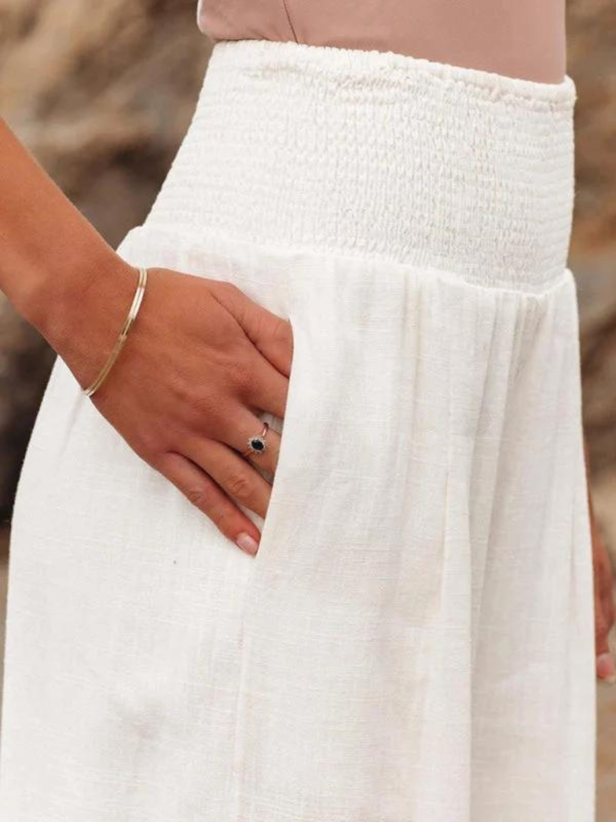 Stylish women's flowing wide-leg pants for beachwear. Relaxed fit, perfect for summer fashion and resort outfits.