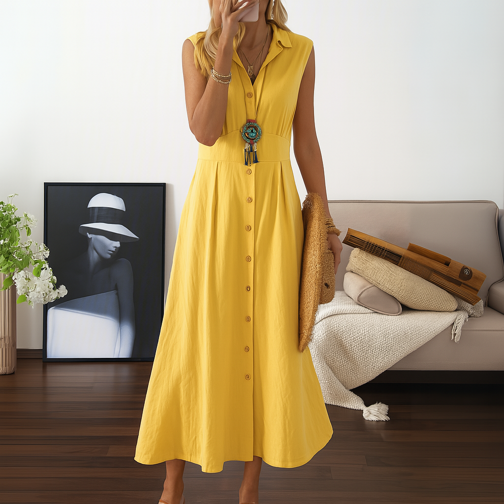 Sleeveless collared A-line maxi dress with full button-down detail, ideal for versatile day-to-night style.