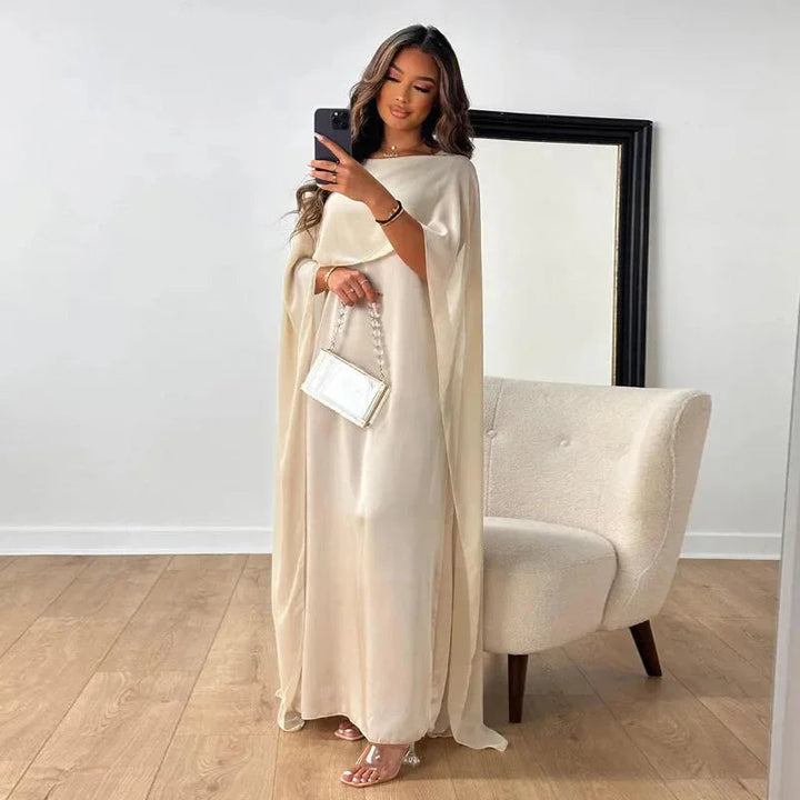Women's flowy batwing sleeve maxi dress in a relaxed fit, perfect for elegant casual wear or special occasions.