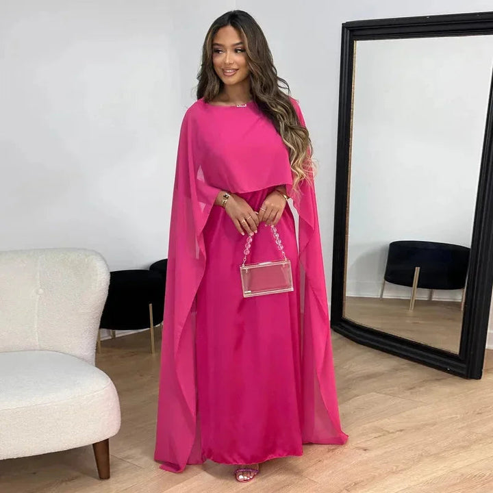 Elegant women's flowy maxi dress with batwing sleeves, offering a comfortable, relaxed fit for summer & spring versatility.