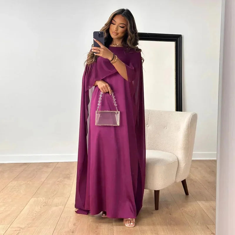 Versatile women's batwing sleeve flowy maxi dress; relaxed fit, ideal for elegant spring outfits or comfortable summer wear.