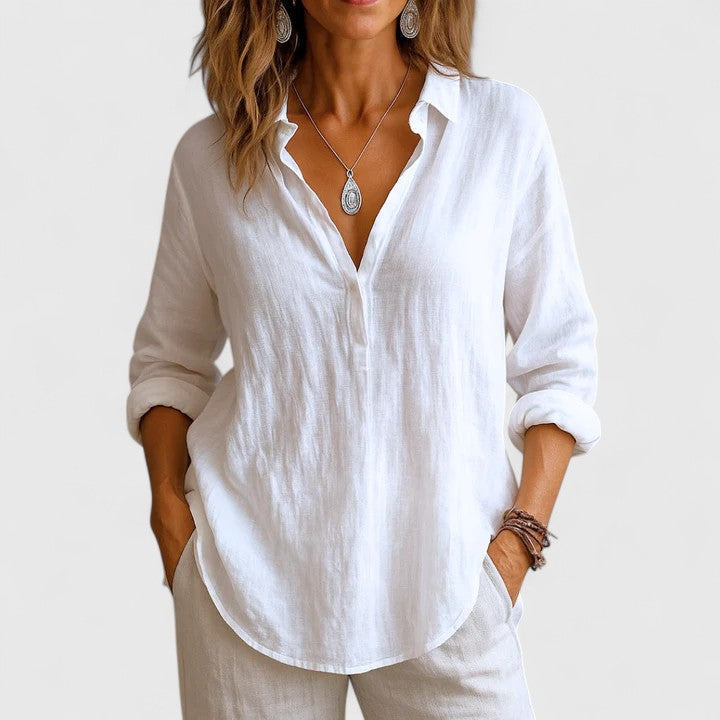 Elegant women's 3/4 sleeve blouse, versatile for spring & summer fashion. Effortless style top.