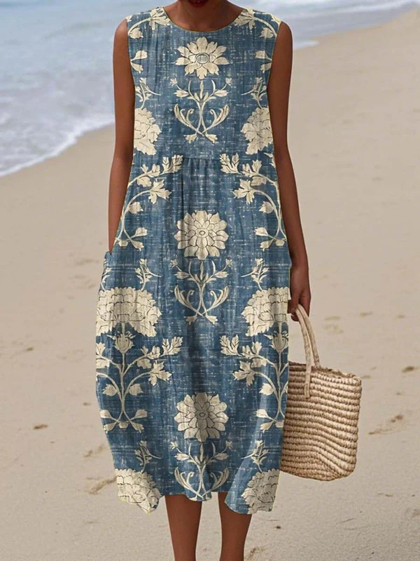 Women's flowy boho midi dress with vibrant floral print, sleeveless design, perfect for summer vacation.