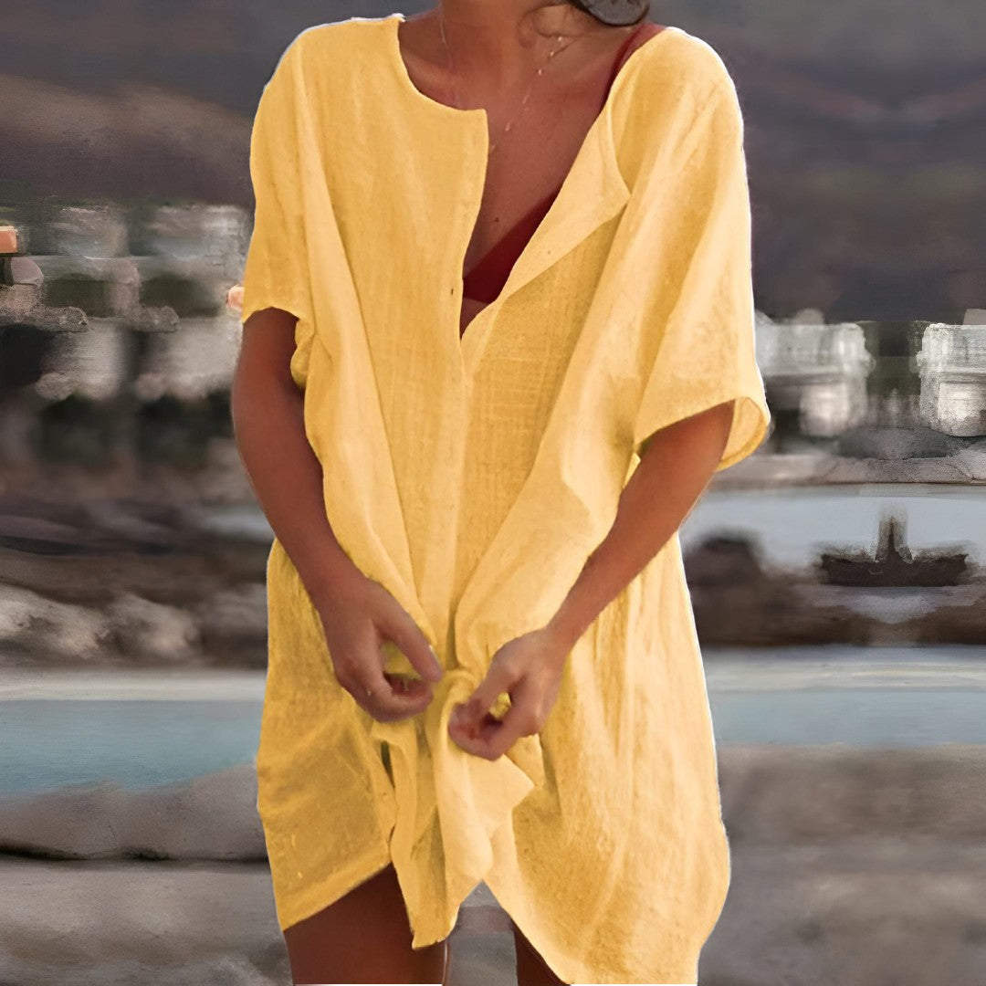 Elegant button-front beach dress for women, versatile resort wear, perfect over a swimsuit.