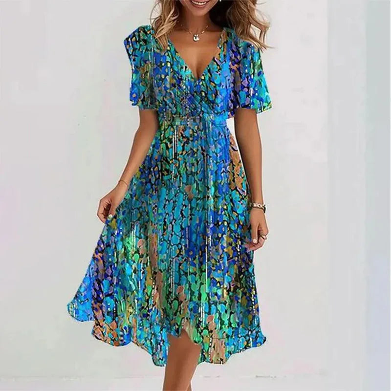 Women's flowy floral knee-length summer dress with V-neck & short sleeves, perfect for casual wear.