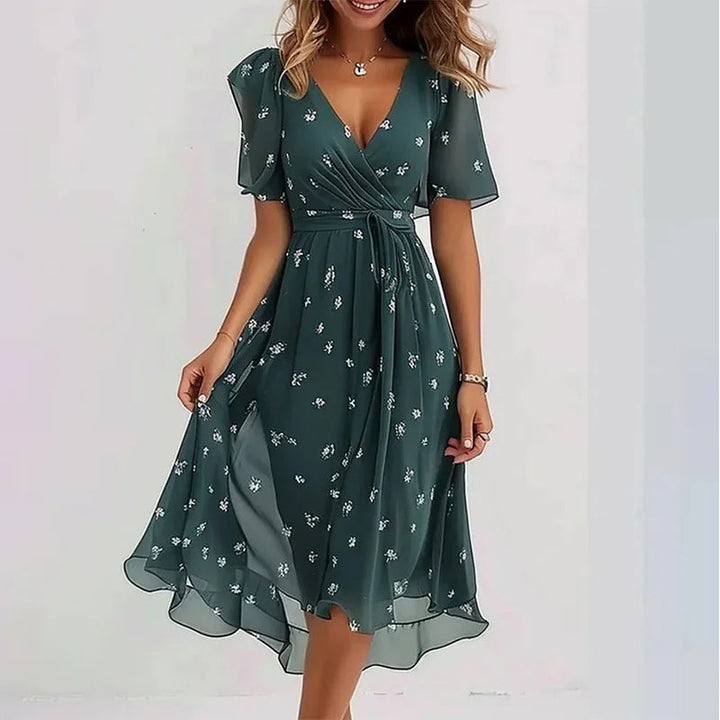 Women's V-neck floral summer dress, knee-length & flowy, with short sleeves, great for everyday chic.