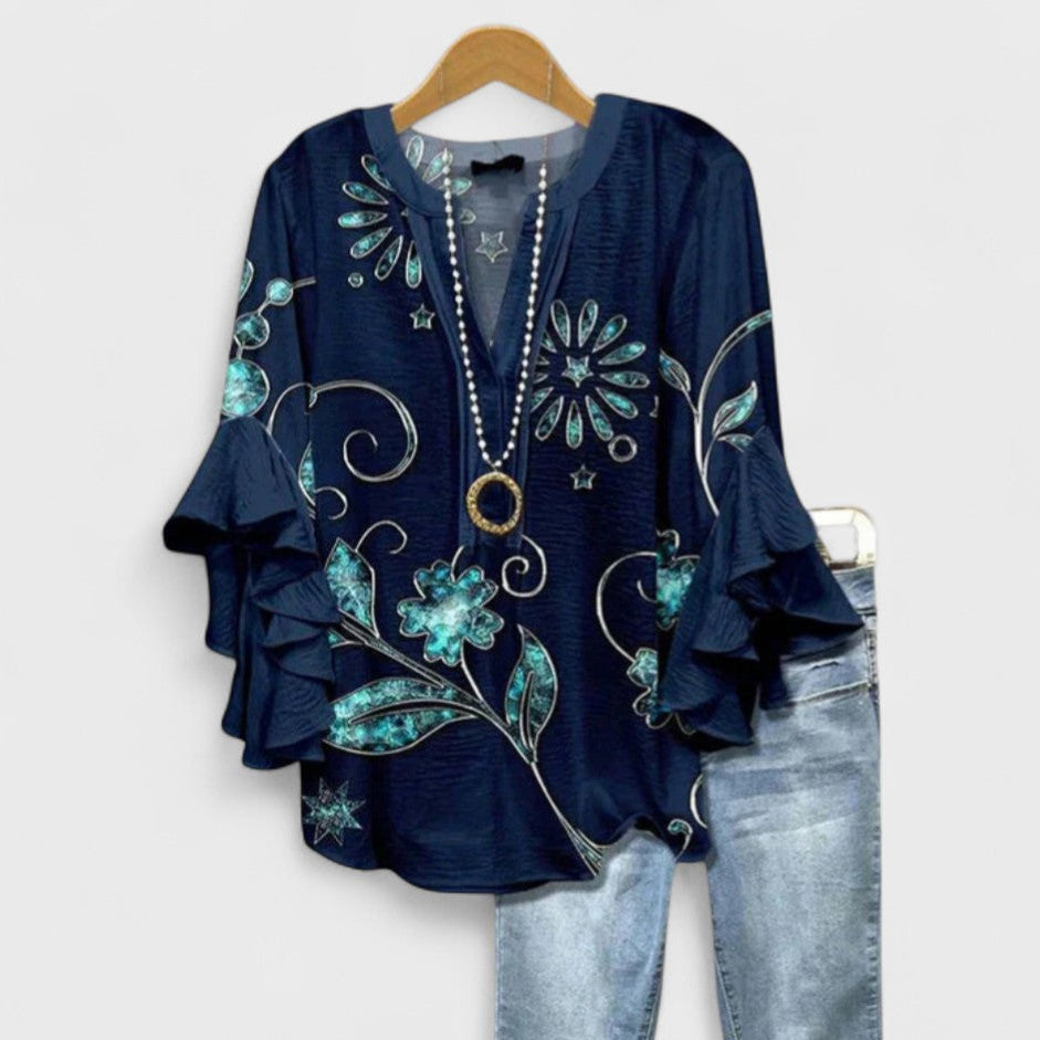 Elegant women's floral blouse, a flowy V-neck top with beautiful ruffle & flare sleeve details.