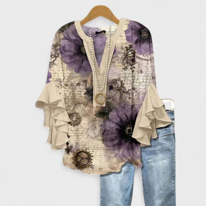 Lightweight women's floral print blouse, a flowy summer top with delicate ruffle & flare sleeves.