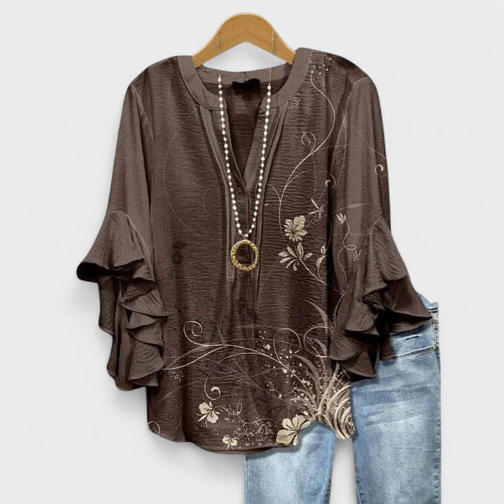 Summer fashion women's floral print blouse, flowy & chic with graceful ruffle flare sleeves.