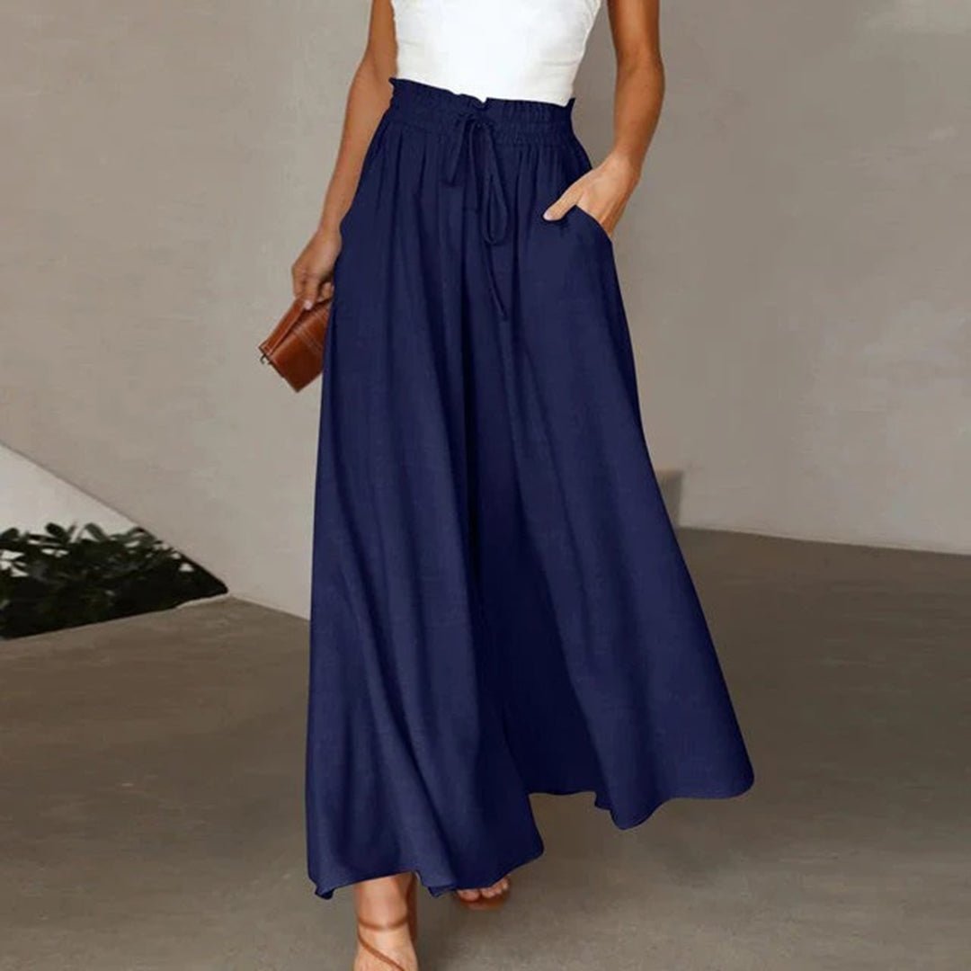 Women's flowy high waist wide leg trousers with a comfortable drawstring. Perfect for casual chic style.