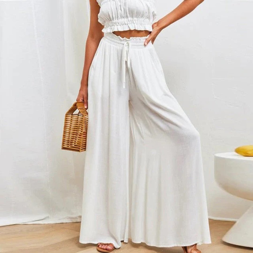 Comfortable women's high waist wide leg pants, featuring a relaxed fit and adjustable drawstring for versatile wear.
