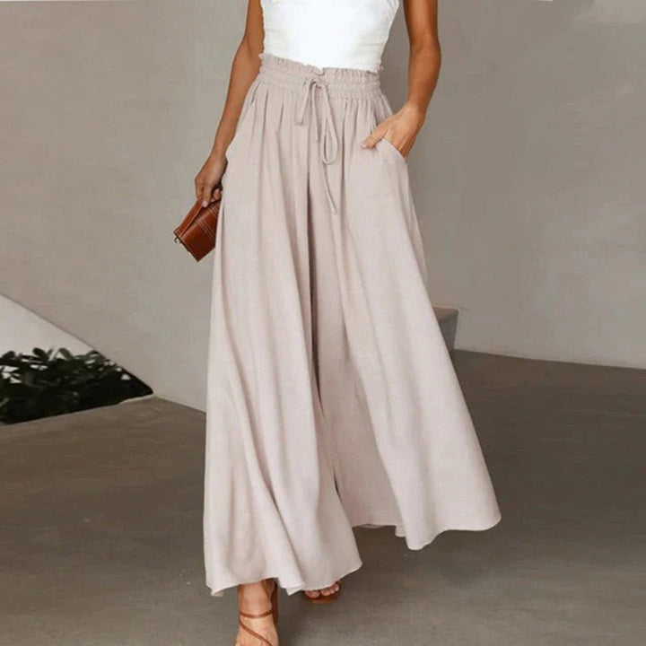 Chic women's wide leg trousers with a high waist and adjustable drawstring. Versatile & comfortable for any occasion.