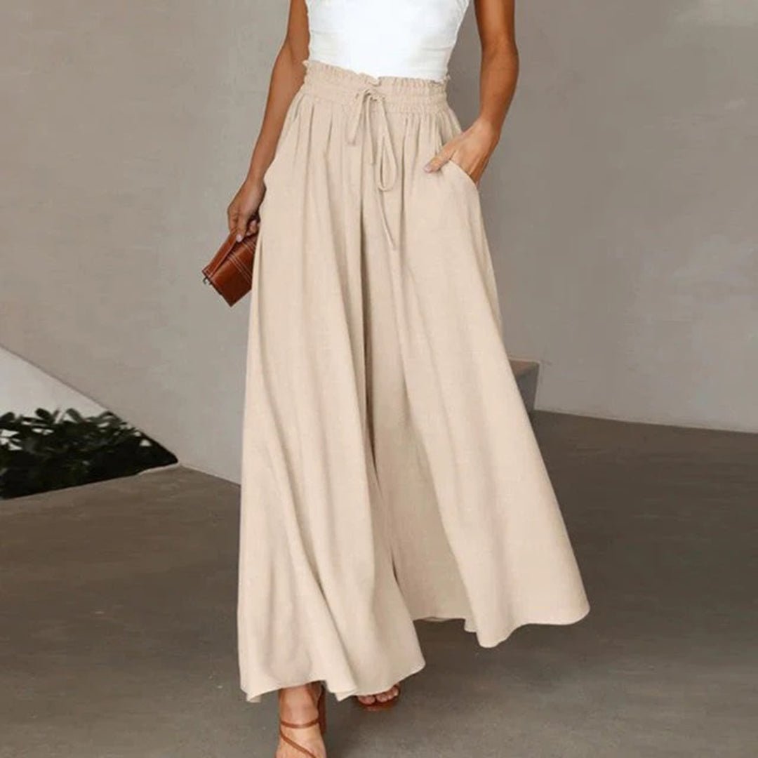 Relaxed fit high waist wide leg pants for women. Flowy fabric and drawstring ensure all-day comfort and style.