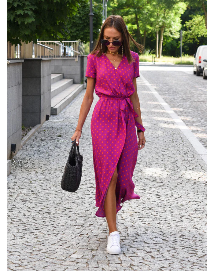 Women's flowy printed maxi summer dress in a vibrant pattern, perfect for effortless casual or elegant style.
