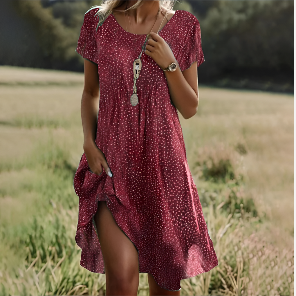 Chic women's flowy summer midi dress. Sleeveless, scoop neck, tie waist for elegant spring/vacation style.