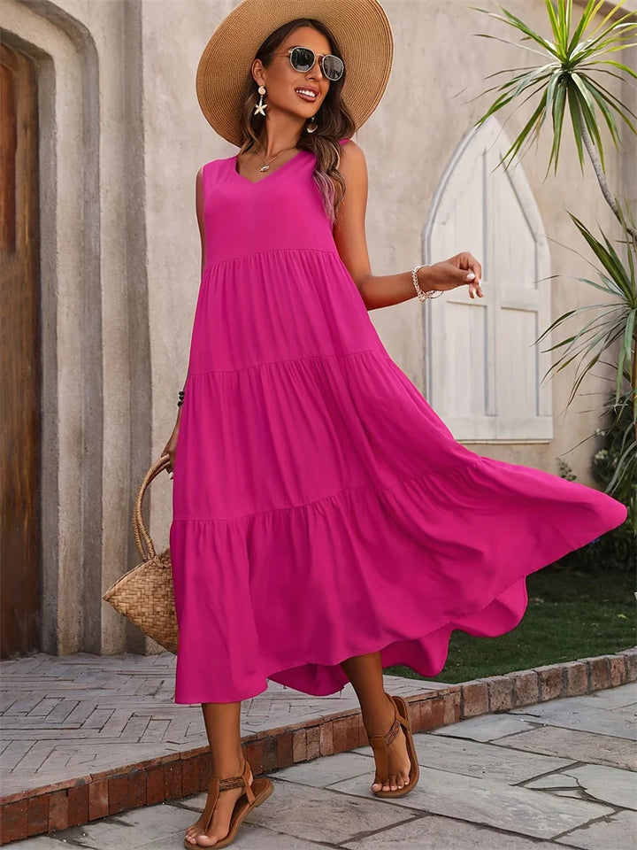 Flowy sleeveless V-neck maxi dress for women, a stylish tiered summer outfit.