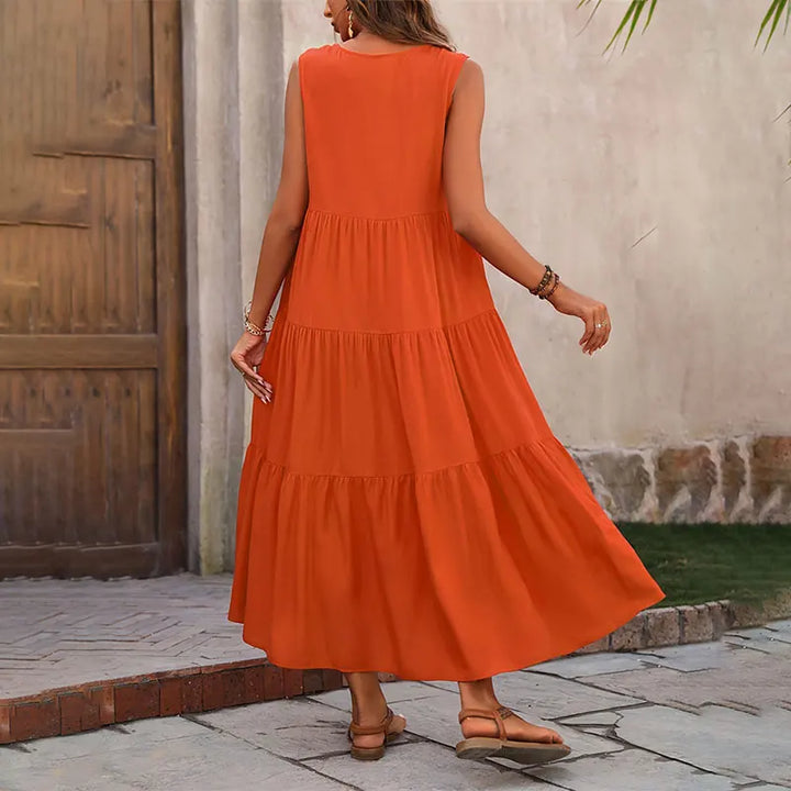 Casual women's tiered maxi dress, featuring a flattering V-neck and flowy silhouette.