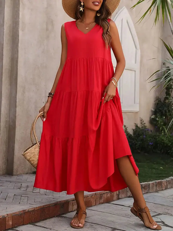 Stylish women's flowy tiered summer dress, perfect as beachwear or a casual dress.