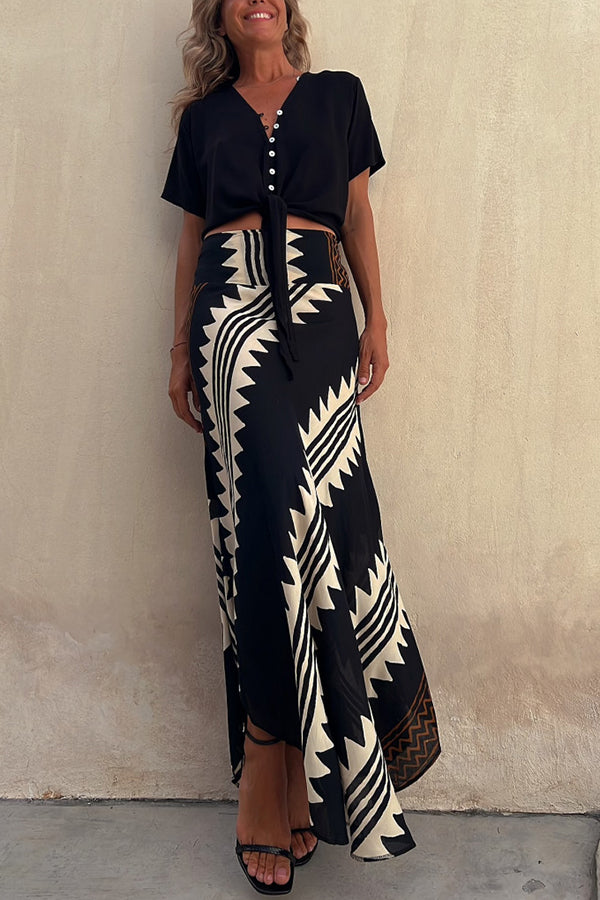 Versatile women's flowy tiered skirt, a pleated maxi style with an elastic waist for effortless wear.