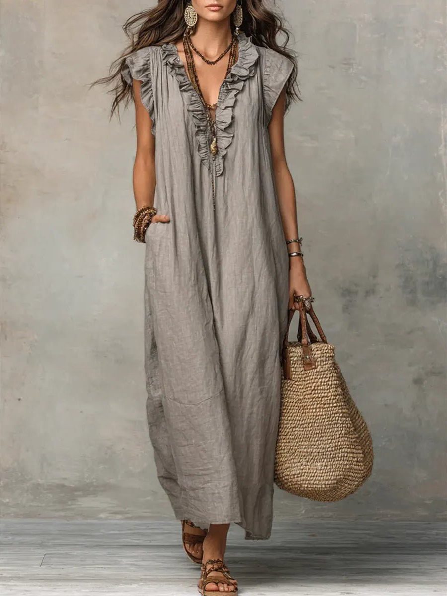Women's flowy V-neck maxi dress with delicate flutter sleeves, perfect for summer comfort.