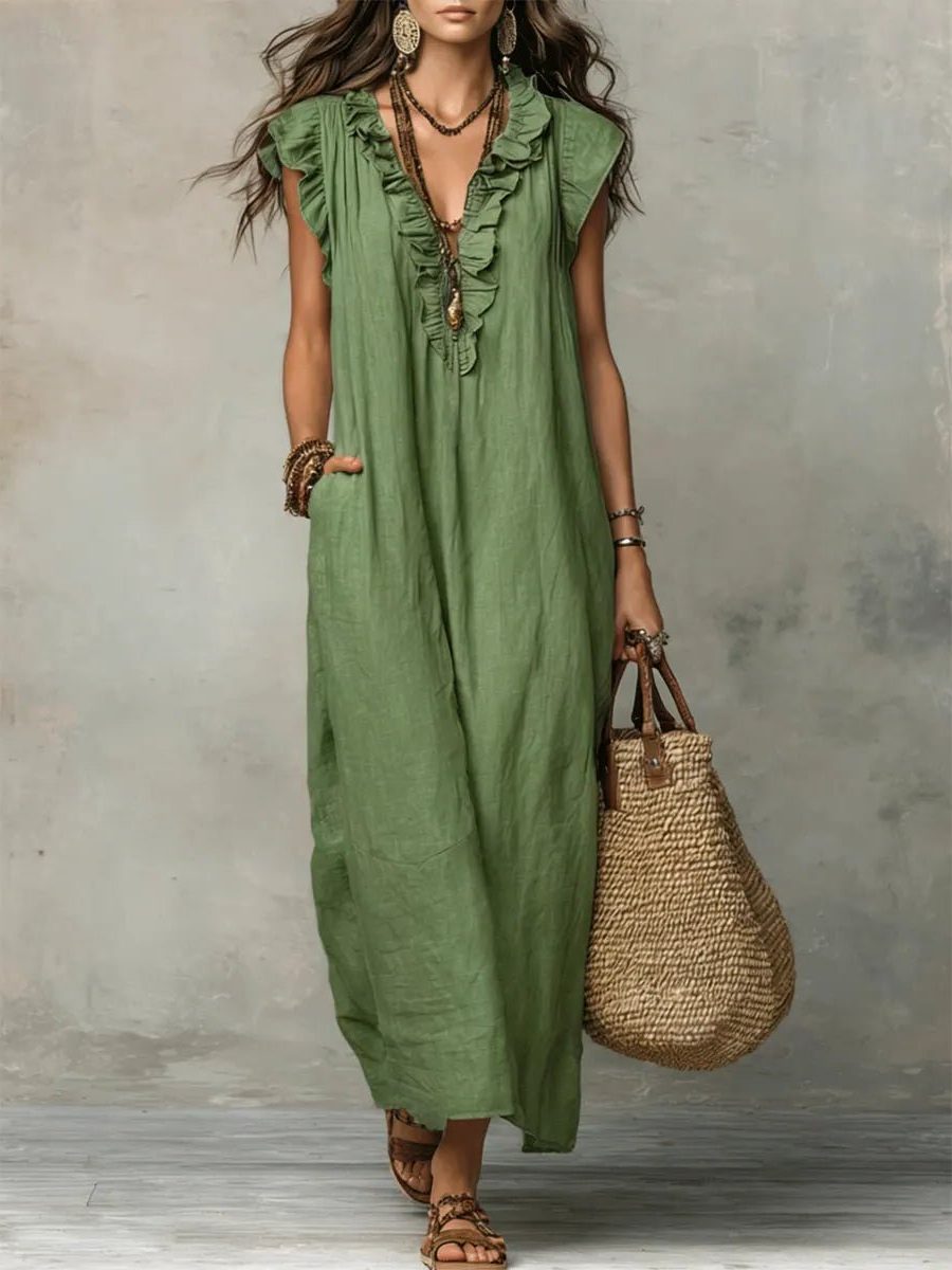 Elegant women's flowy maxi dress, V-neck, flutter sleeves; ideal for beach vacations & casual wear.