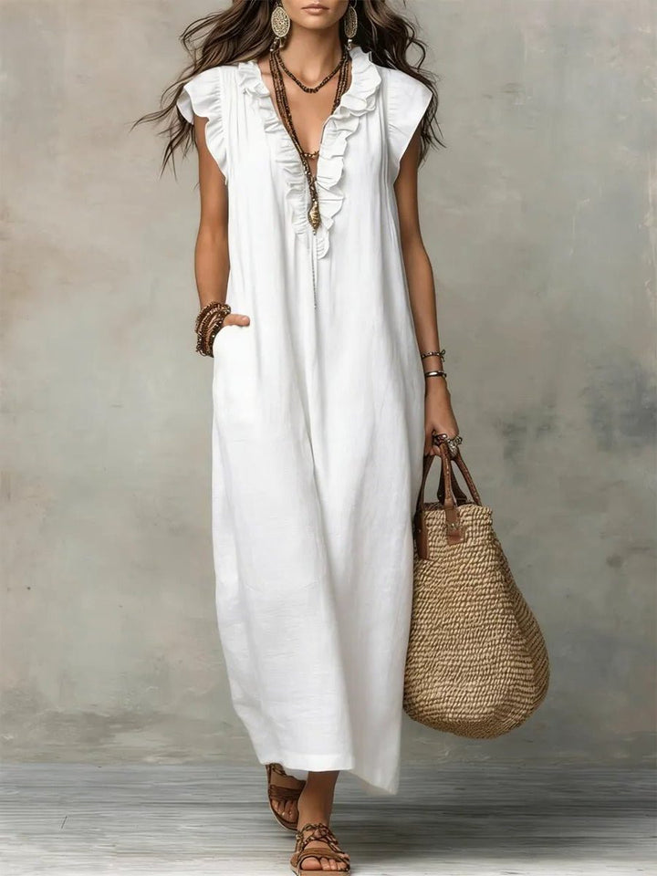 Versatile women's flowy V-neck maxi dress, flutter sleeves, great for summer, beach, or casual outings.