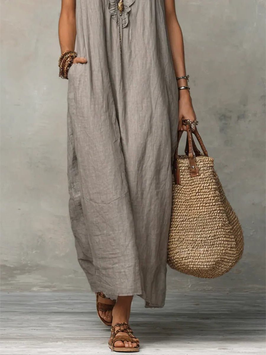 Beautifully flowy women's maxi dress, V-neck, flutter sleeves; perfect for elegant summer comfort.