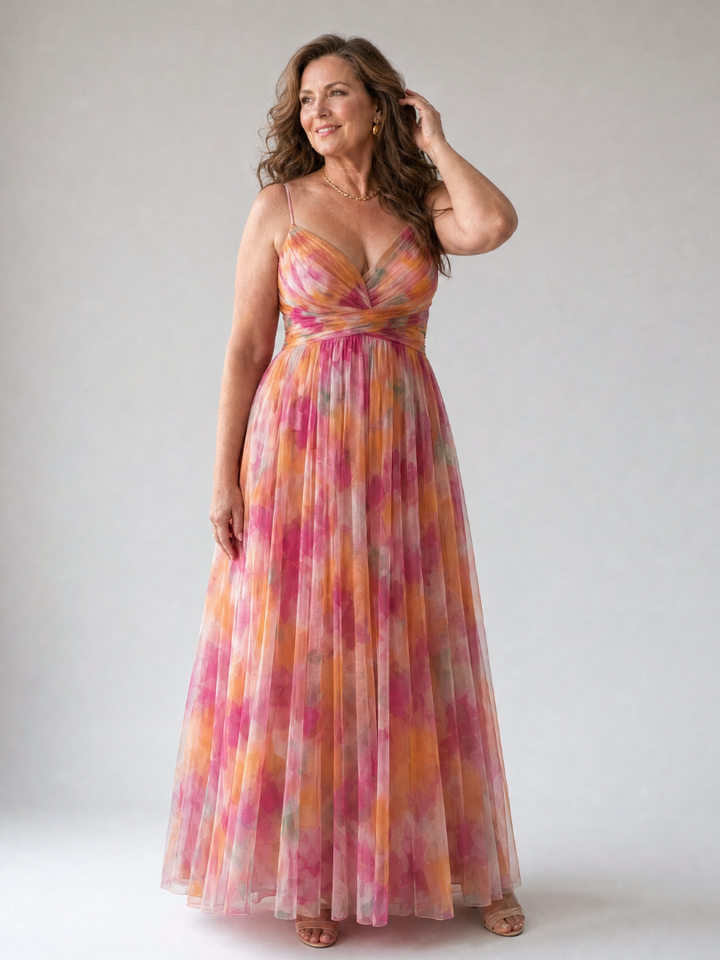 Back view of a women's flowy wrap maxi dress, highlighting its elegant drape and comfortable summer design.