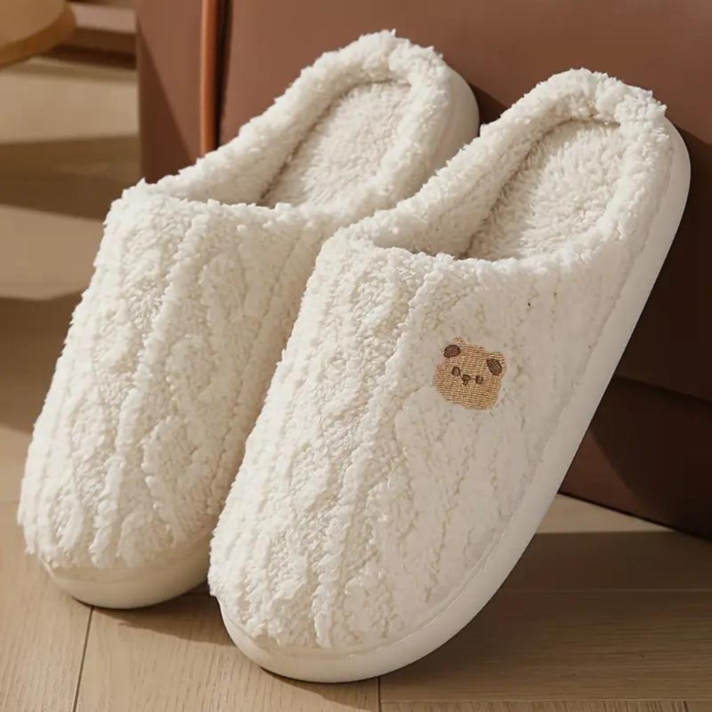 Women's fluffy bear slippers for cozy winter comfort. Cute indoor house shoes, warm loungewear.