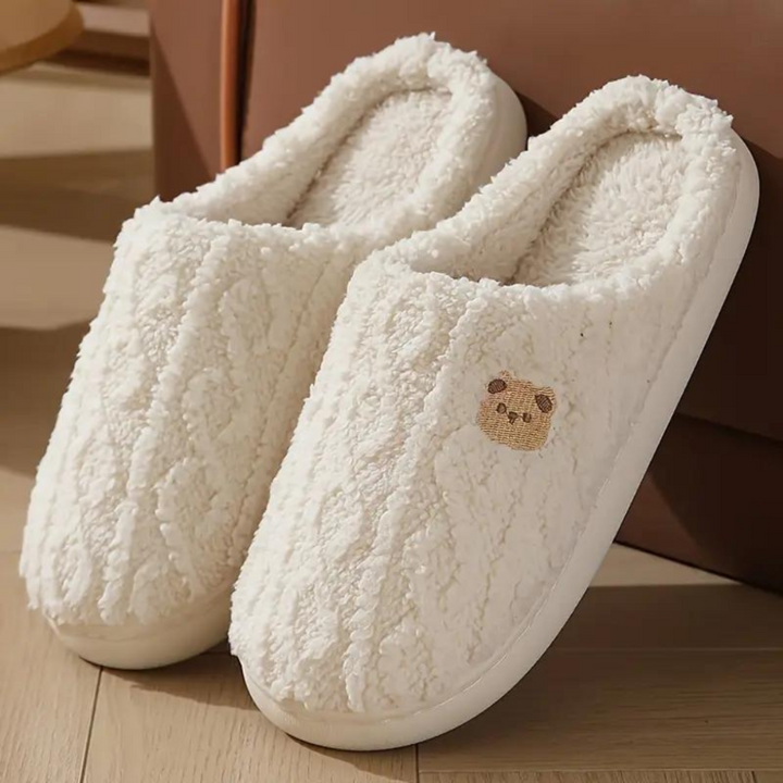 Women's fluffy bear slippers for cozy winter comfort. Cute indoor house shoes, warm loungewear.