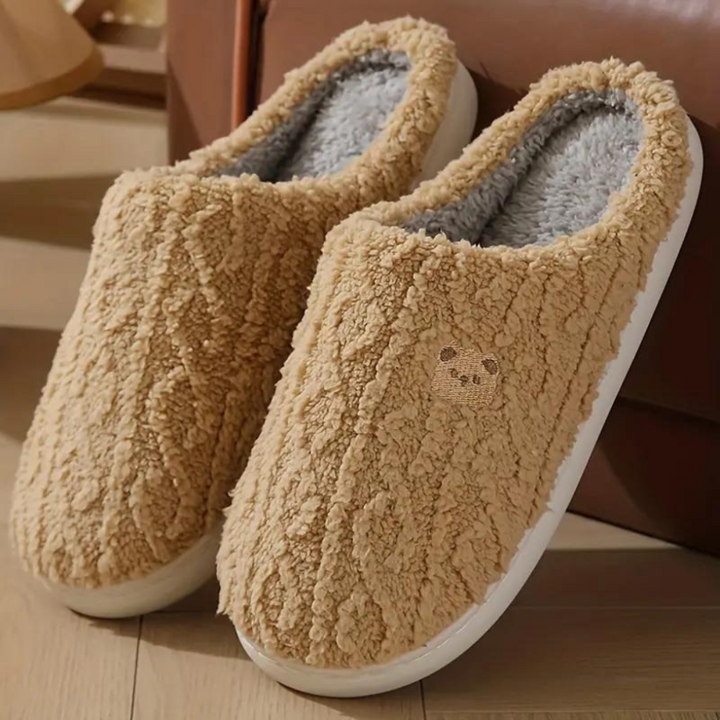 Cute women's bear slippers with fluffy design for ultimate warmth & comfort. Ideal winter indoor footwear.