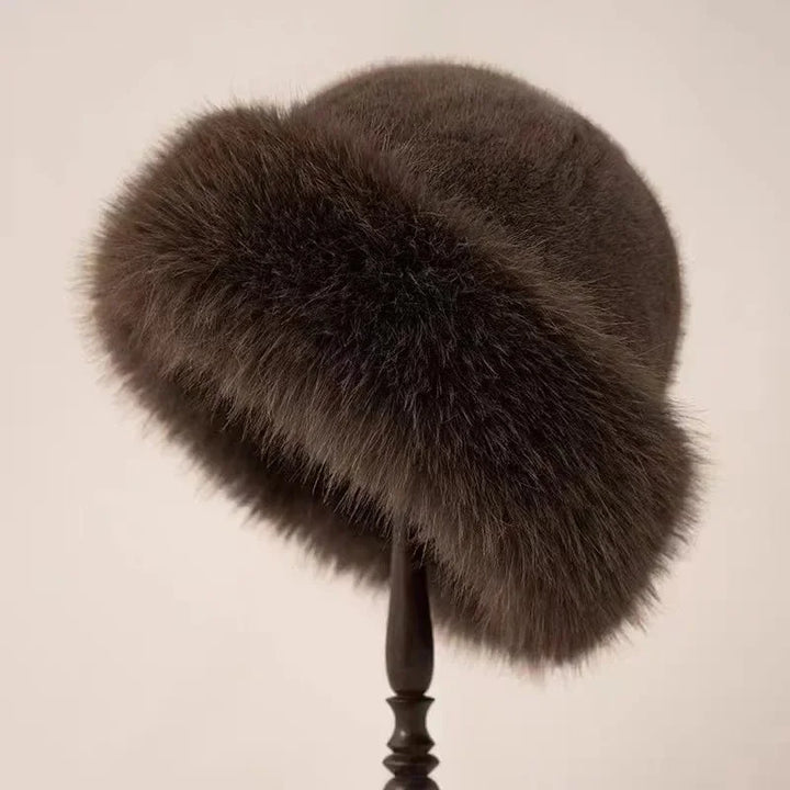 Stylish women's fluffy faux fur winter hat, featuring a wide cuffed brim for superior warmth and comfort.