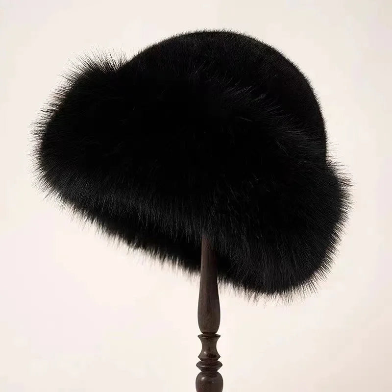 Warm women's fluffy faux fur winter hat with a protective wide brim, essential for cold weather and winter fashion.