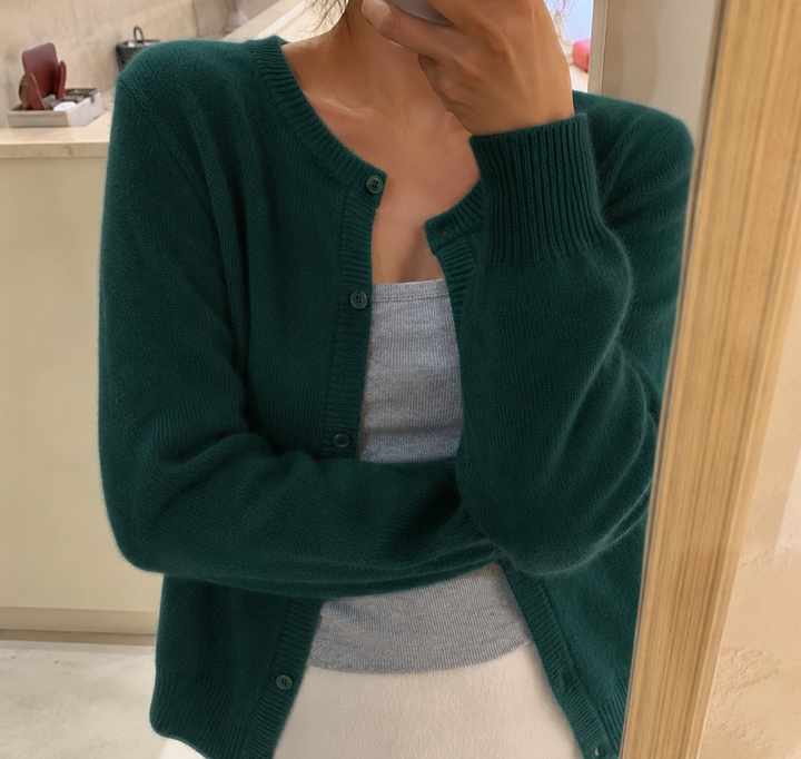 Stylish women's fluffy knit cardigan. Round neck, button front design. Versatile autumn/winter casual wear.