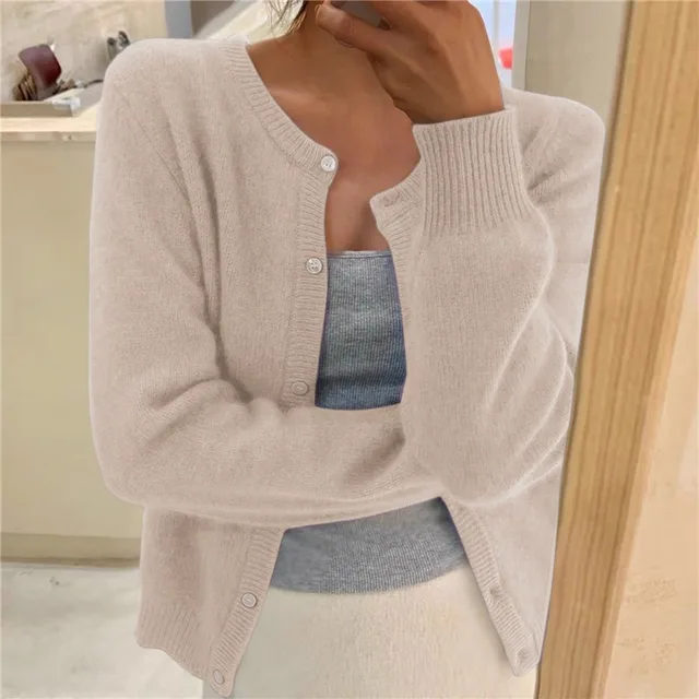 Chic women's cropped fluffy knit cardigan with round neck & button front. Relaxed fit for casual wear.