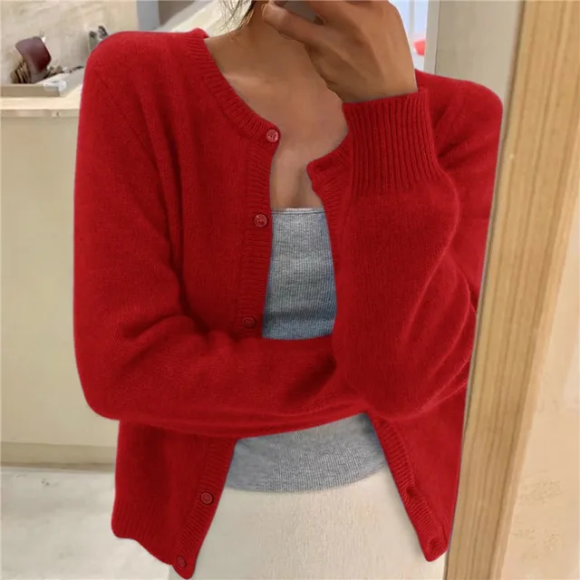 Cropped fluffy knit women's cardigan with round neck and button front. Trendy autumn/winter layering piece.