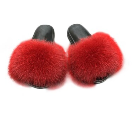 Top-down view of women's fluffy open-toe slide slippers, luxurious and comfortable house footwear.