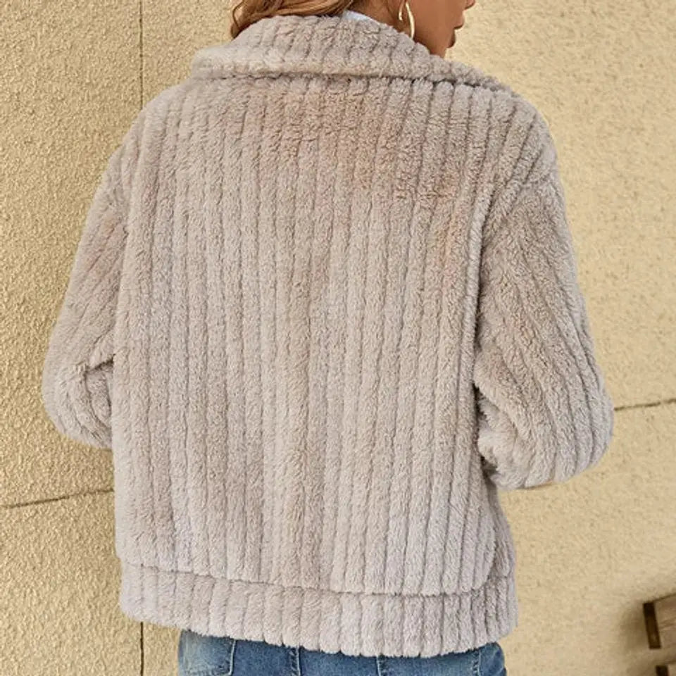Woman in a warm & cozy fluffy zip-up quilted jacket, showcasing its casual style for autumn & winter outings.
