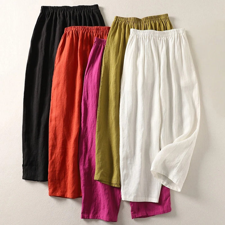 Pink women's wide-leg fluid trousers made from a soft cotton blend, perfect for summer casual chic.