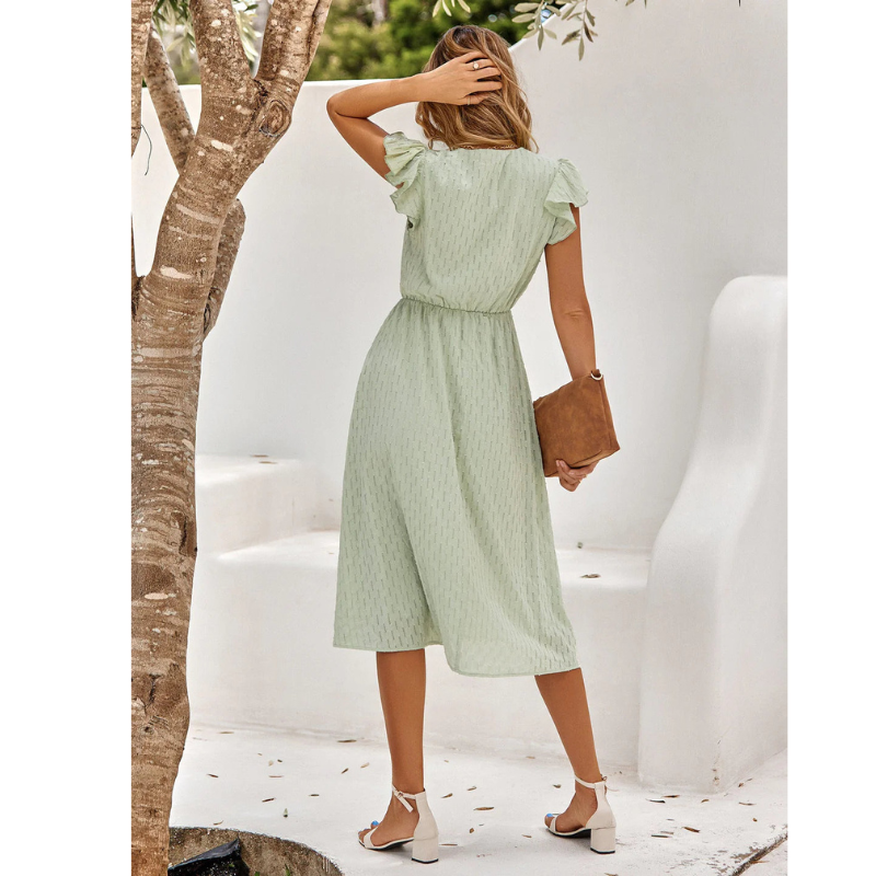 Fashionable women's flutter sleeve midi dress with a relaxed A-line skirt. Comfortable and elegant for any occasion.