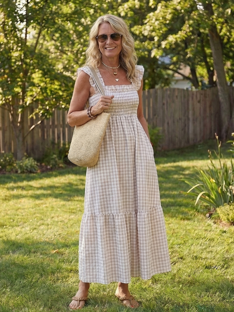 Women's flutter sleeve smocked gingham maxi dress with square neck. Ideal comfortable summer fashion.
