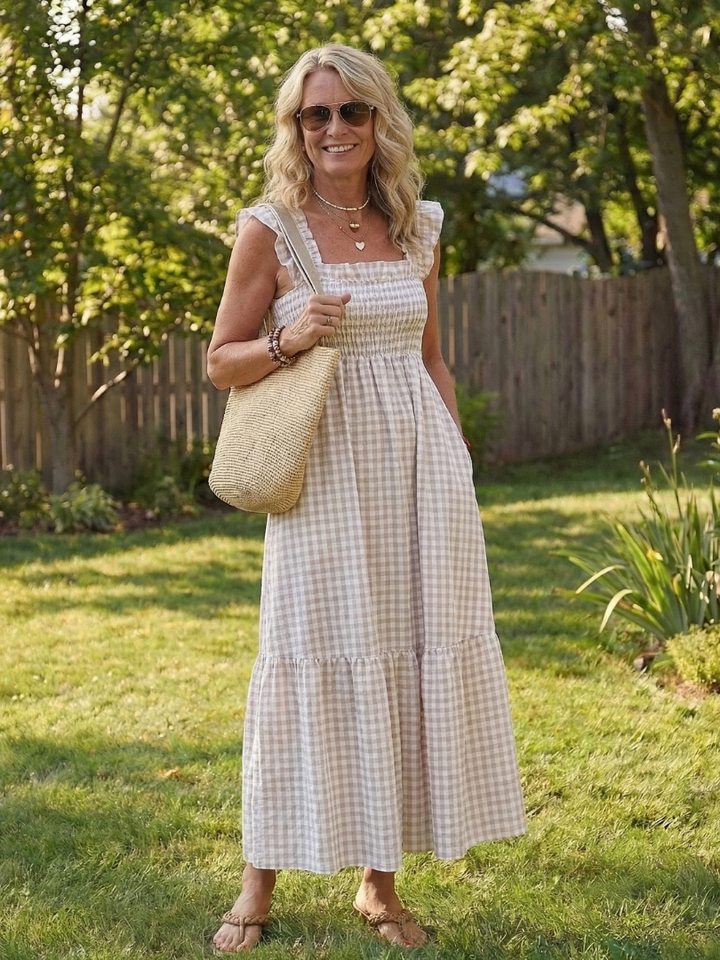 Women's flutter sleeve smocked gingham maxi dress with square neck. Ideal comfortable summer fashion.