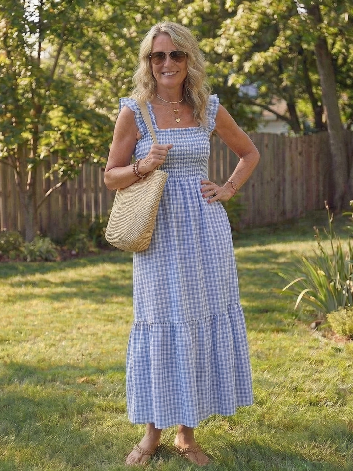 Versatile women's tiered gingham maxi dress with smocked bodice, flutter sleeves & square neck. Summer fashion.