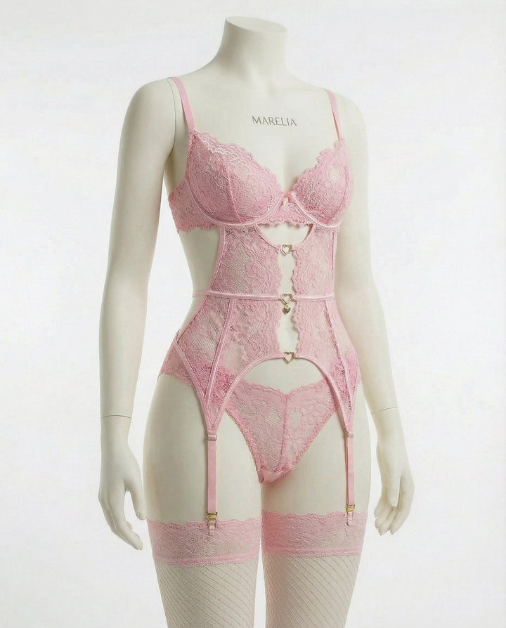 Feminine women's four-piece romantic lingerie set featuring suspender belt and delicate details.