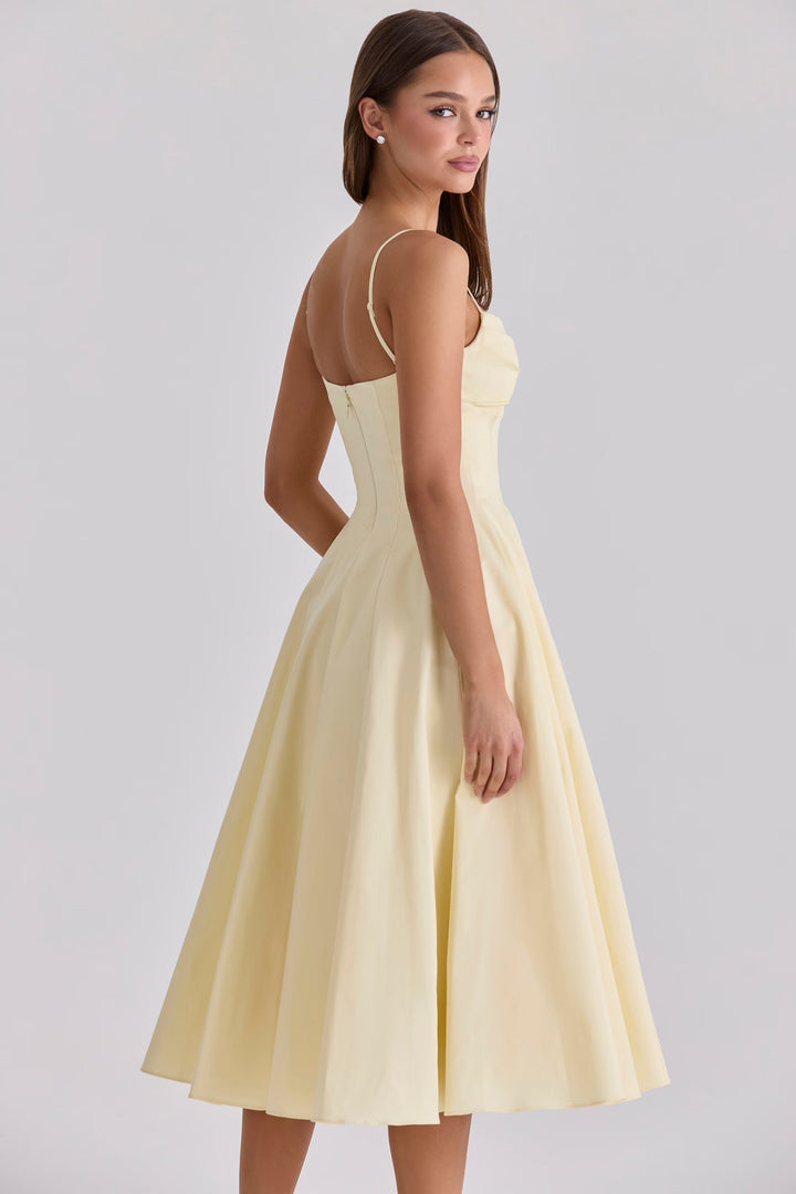 Chic yellow midi dress with gathered bust for effortless summer style, a perfect day dress or vacation outfit.