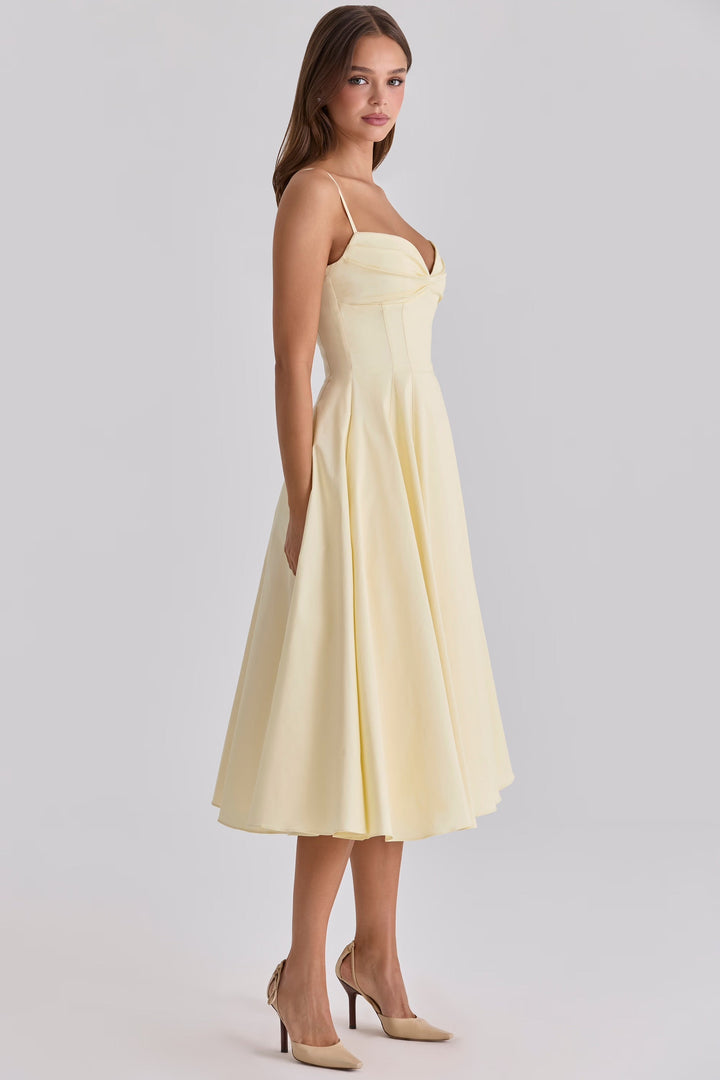 Elegant yellow women's midi dress featuring a stylish gathered bust, ideal for casual summer fashion and comfort.