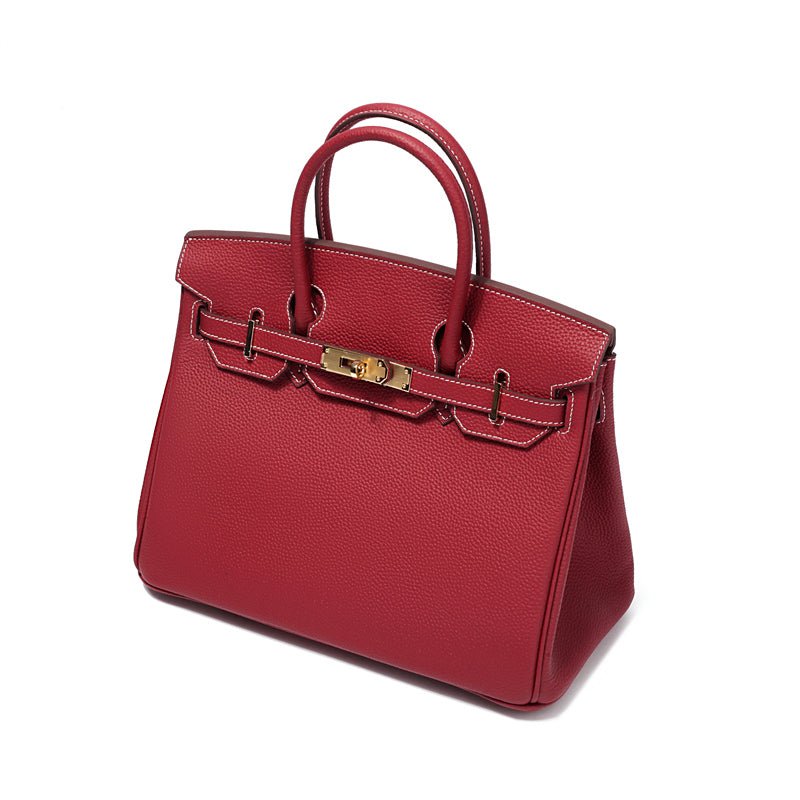 Spacious women's genuine leather shoulder bag, open view showing functional interior, everyday carry.