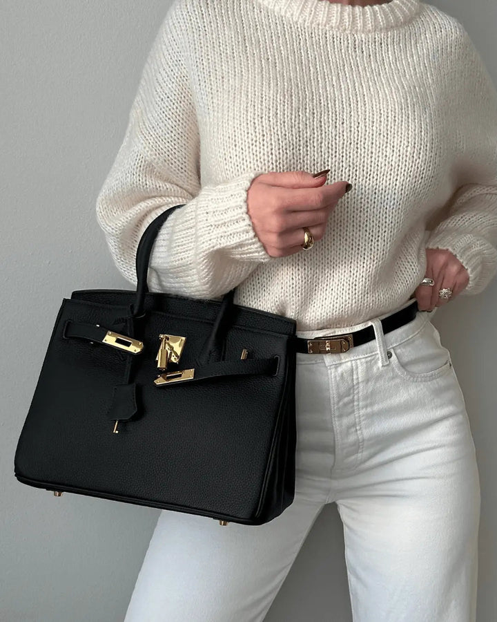 Luxe genuine leather women's handbag, an elegant everyday carry and fashion accessory.