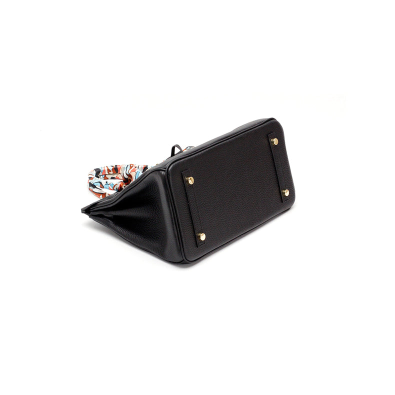 Genuine leather women's luxury handbag, classic design with modern functionality.