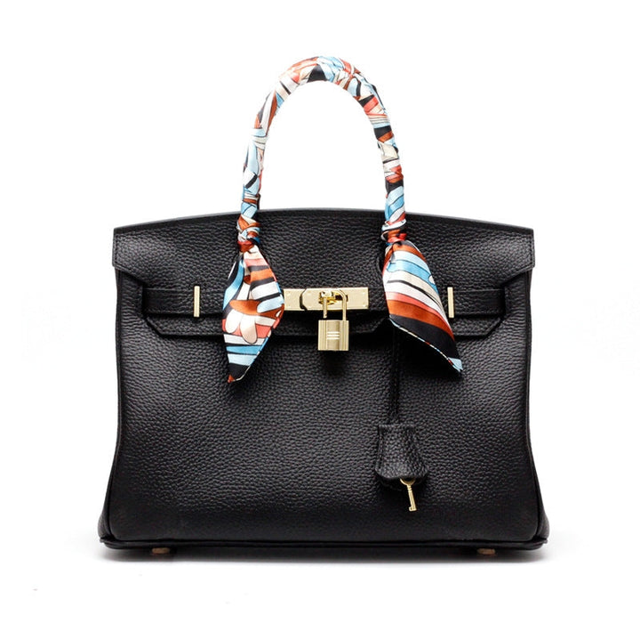 Women's luxury genuine leather handbag, a symbol of elegance and superior craftsmanship.